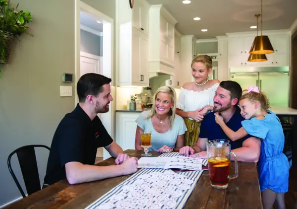 Homeowners reviewing financing terms and agreement details